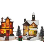 11-piece light-up Christmas village set with houses and figurines—a festive collectible gift
