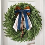 24-inch Artificial Norfolk Pine Front Door Wreath, accented with pinecones and berries