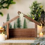 Wooden Nativity scene (manger) with a star-topped roof—a collectible tabletop decoration